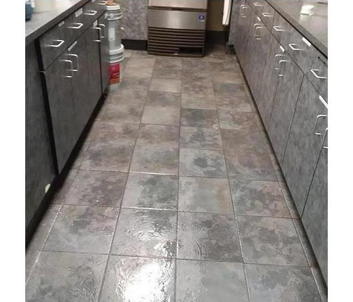Retail flooring damaged by water