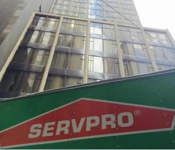 SERVPRO truck parked in front of large commercial office building