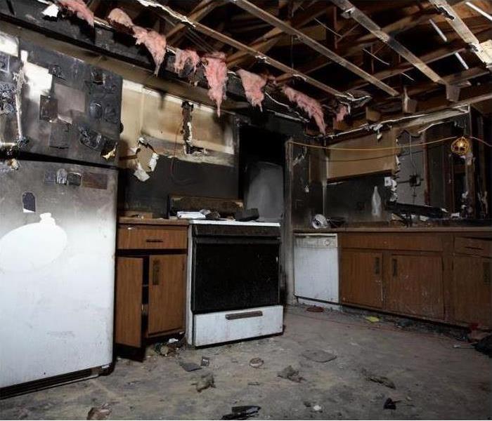Kitchen with heavy fire damage